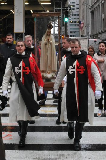 At noon members of the American Society for the Defense of Tradition, Family and Property (TFP) dressed in ceremonial TFP habit solemnly processed with the statue of Our Lady of Fatima.