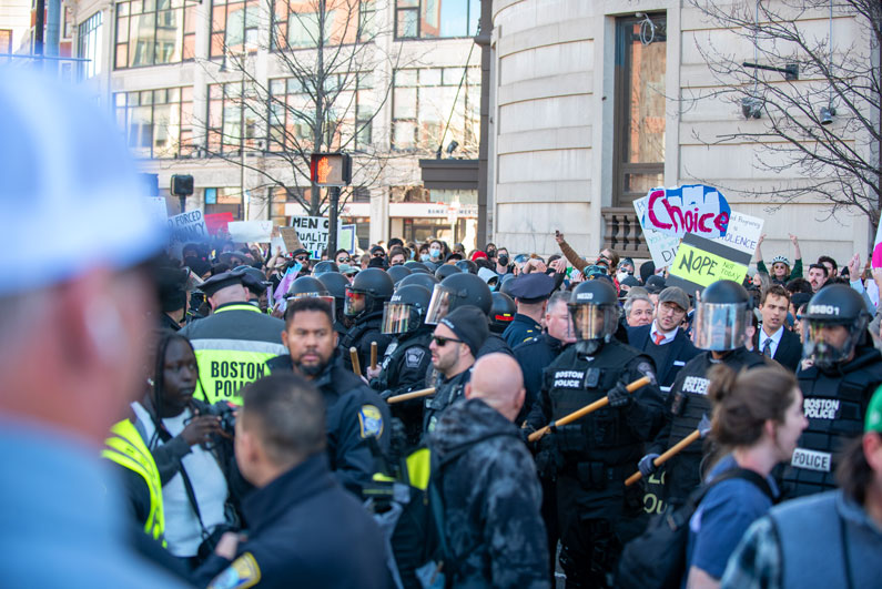 Police formed in front of the Mens March to press forward against the pro-abortion advocates