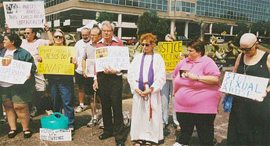 How would these protesters outside the Bishops' Conference meeting in St. Louis answer the Schiltz Challenge?