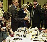 After the lecture, many attendees were anxious to buy their copy of Defending a Higher Law.