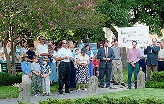 Catholics gather for an act of reparation in Lafayette, La., while two dozen revelers "paraded" in disrepect to a climate of mourning for hurrican victims.