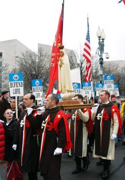 The statue of Our Lady of Fatima was carried by an escort of TFP members in ceremonial habit