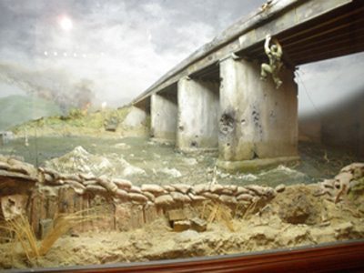 The diorama inside Bancroft Hall of the United States Naval Academy which depicts Colonel Ripley dangling below the Dong Ha Bridge.