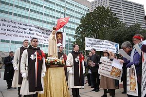 TFP members, wearing the TFP ceremonial habit, escort a pilgrim statue of Our Lady of Fatima at the protest.