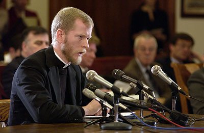 Fr. Pacholczyk testifying before the Massachusetts Senate Committee on Science and Technology. Photograph by Cory Silken, courtesy of The Pilot.