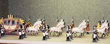 A papal parade, featuring the Vicar of Christ in a gilded carriage surrounded by Swiss and Noble Guards