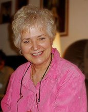 Patricia Dowd, who was also at the visit, appreciates the soothing aspect of the psaltery's sound.