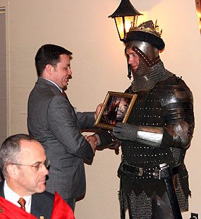 William Sweeney of West Virginia enthusiastically receives a memento of Charlemagne at the closing banquet.