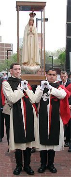 TFP members in ceremonial habit escort Our Lady