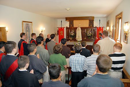 Praying before the miraculous International Pilgrim Virgin statue of Our Lady of Fatima - TFP Summer Camp