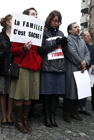 Participants hold sign 'The Family is Sacred!' at Paris Traditional Marriage Rally