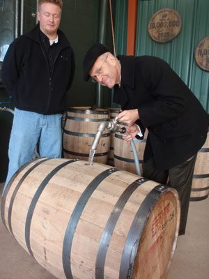 Pouring “white lighting” into a virgin white oak barrel at the Jim Beam distillery