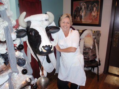Clara Bell, the life size Holstein cow with Mammy's owner Christy Clark normally has a prominent place in the Restaurant's front window