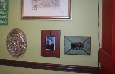 A picture of the Breakfast Club (right) whose members make up "the regulars" and a photo of the late Judge Bob Heaton (center) who enjoyed Mammy's for five years