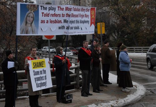 Dozens of protesters braved the cold to defend the honor of Our Lady. Many motorists honked in agreement.