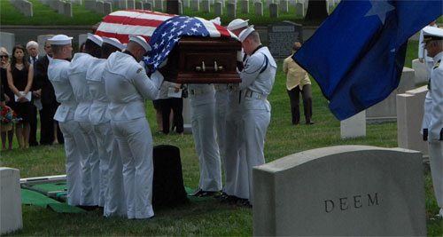 Placing Rear Admiral Jeremiah Denton's coffin on his resting place in Arlington National Cemetery