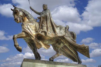 King St. Louis IX stands with many canonized kings and nobles.