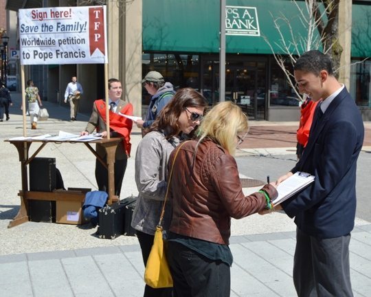 United States — Collecting signatures at a campaign table of the American TFP.