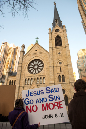 Catholics Pray Outside Cathedral Where Controversial Jesuit Speaks