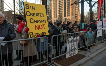 Catholics Pray Outside Cathedral Where Controversial Jesuit Speaks